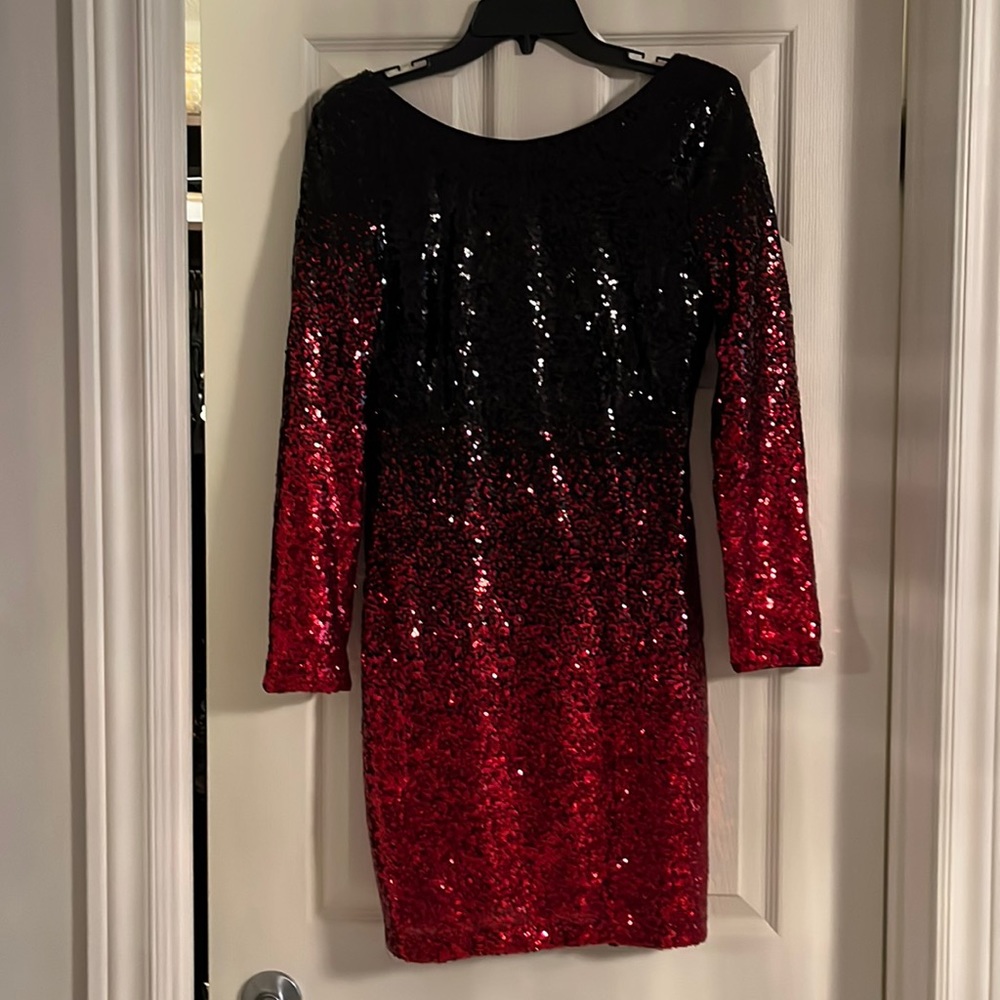 Long sleeved red and black sequinned dress.